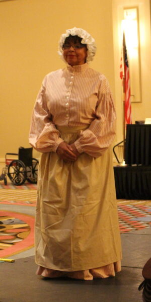 Shannon Prince wearing a fugitive slave’s dress from the mid 1800s